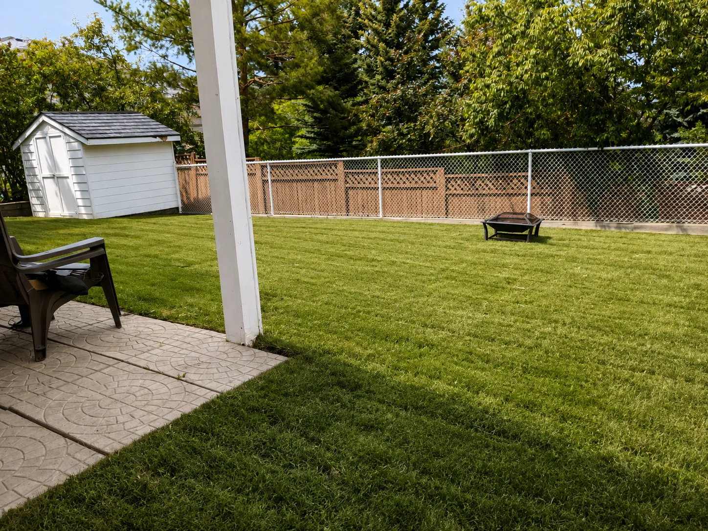 Somerset crew maintaining a Calgary lawn as part of seasonal lawn maintenance