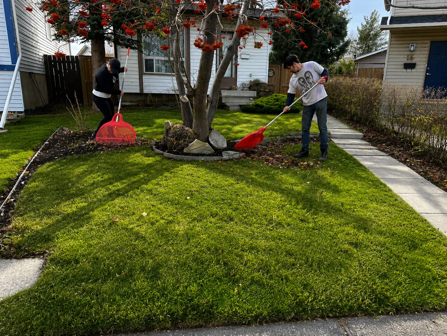 Seasonal cleanup crew at work on a Calgary property